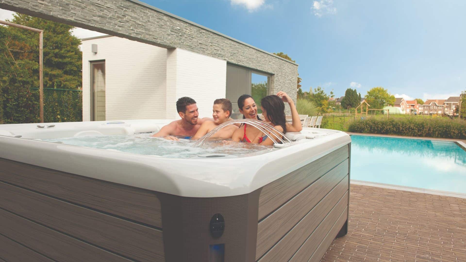 a family enjoying one of these 3 ways to spend quality family time in a hot tub